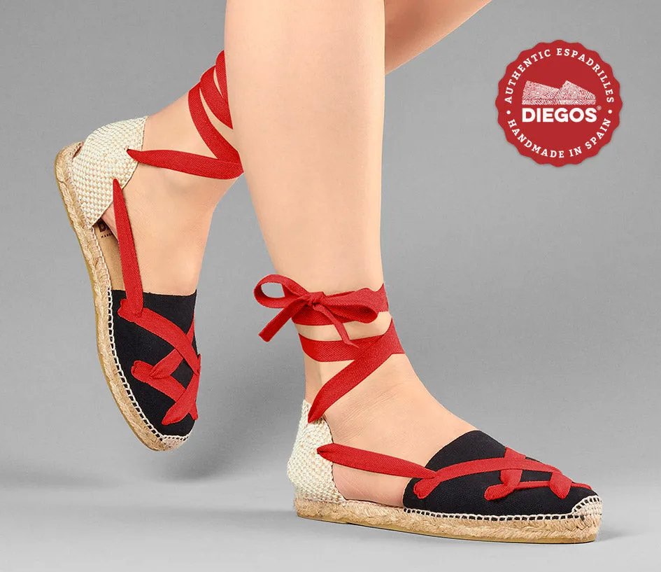 Alpargatas planas Lola clásicas cordones negras