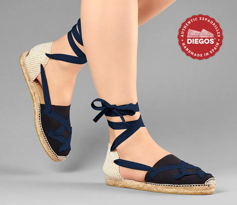 Alpargatas planas Lola clásicas cordones negras
