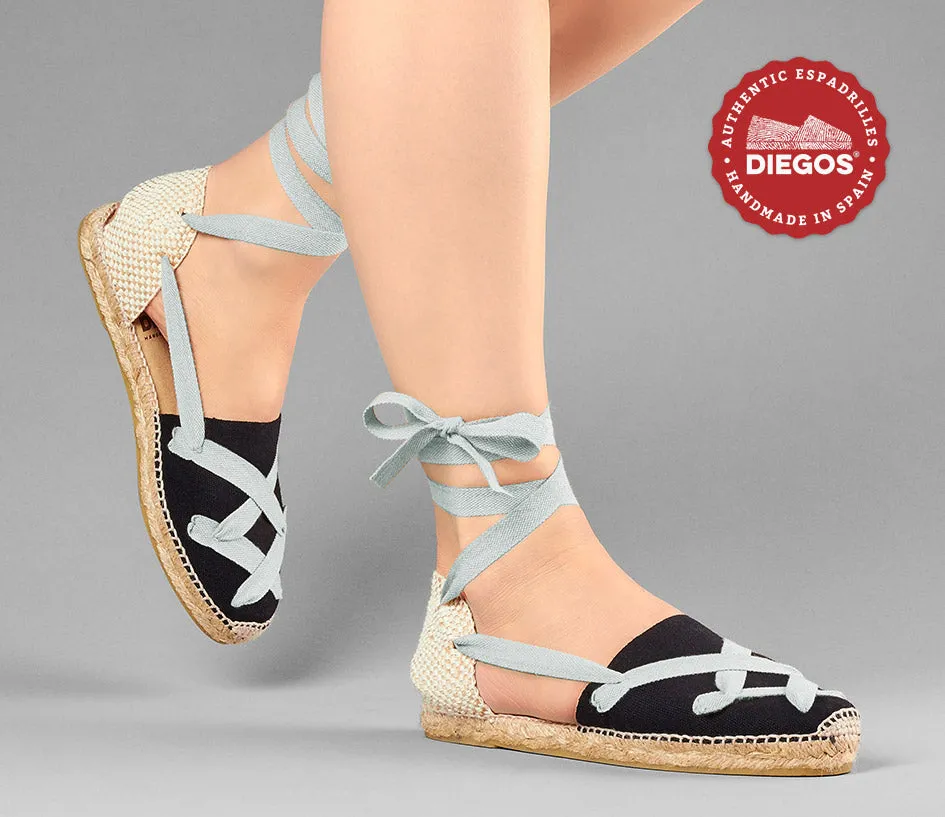 Alpargatas planas Lola clásicas cordones negras