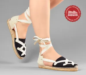 Alpargatas planas Lola clásicas cordones negras