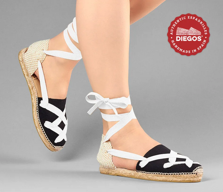 Alpargatas planas Lola clásicas cordones negras